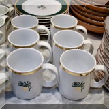 K03. Set of Eddie Bauer pine cone dessert plates (8) and mugs (6) - $65 